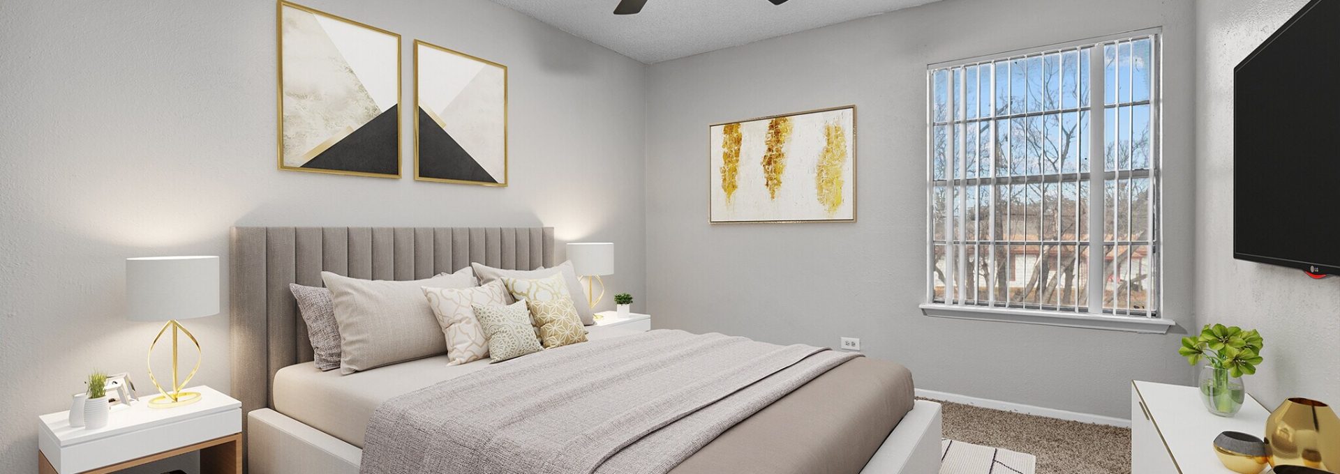 a bedroom with a ceiling fan and a bed at The Northwood Apartments